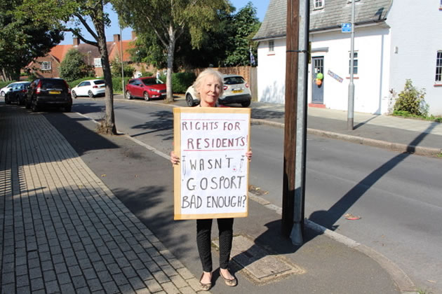 Janis Humberstone with her placard on way to the protest 