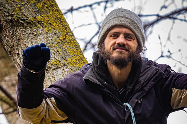 Marcus Carambola, 32, in the tree in York Gardens