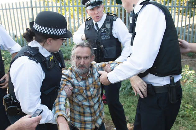 Roger Hallam being arrested 
