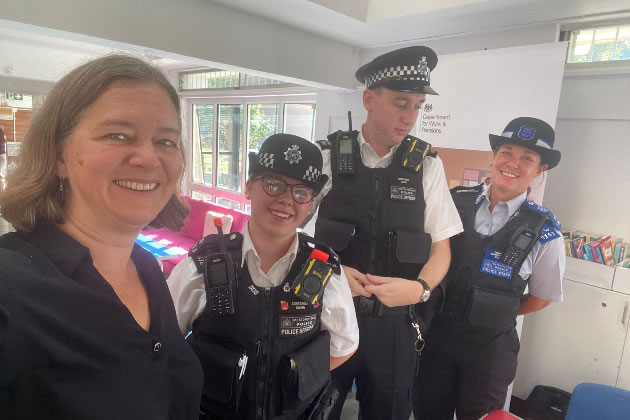 Fleur Anderson with portly police officers 