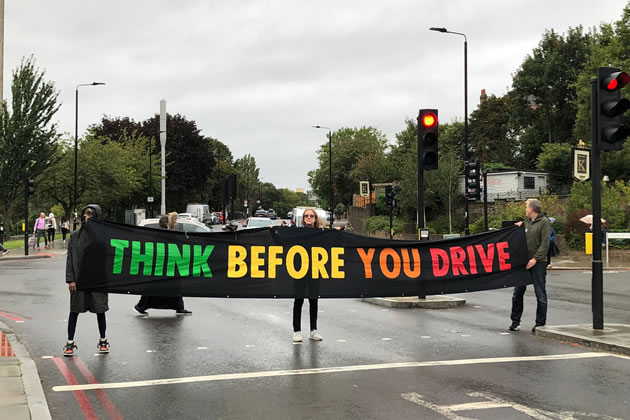Protestor hold 'Green Man Swarm' on Roehampton Lane