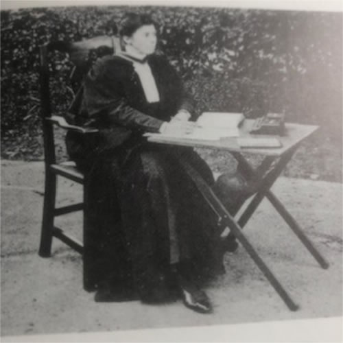 The headmistress of Putney County in full university gown