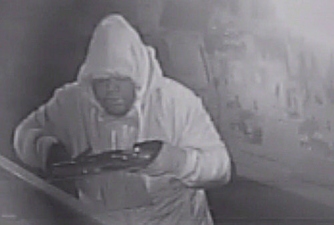 CCTV Image Of Burglar Raiding Phone Shop Released 